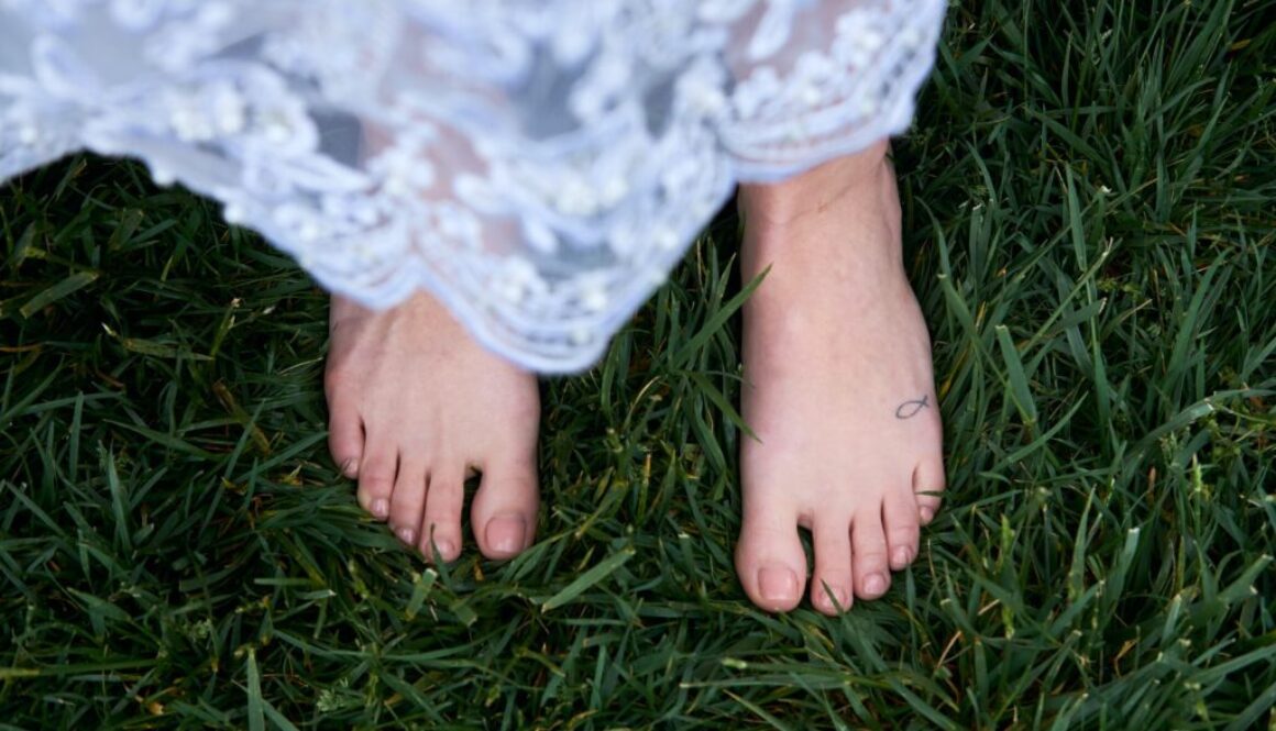 Image of woman barefoot in grass